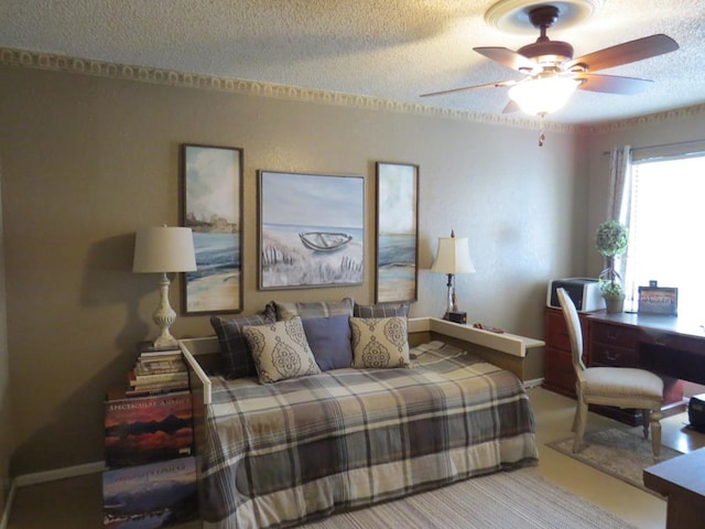 bedroom with baseboards, a textured ceiling, and ceiling fan