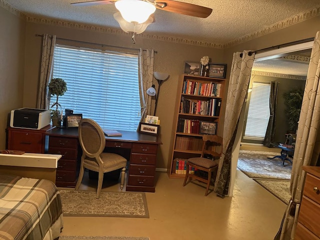 home office with a ceiling fan, a textured ceiling, and concrete floors