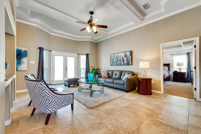 living area featuring crown molding, french doors, visible vents, and plenty of natural light