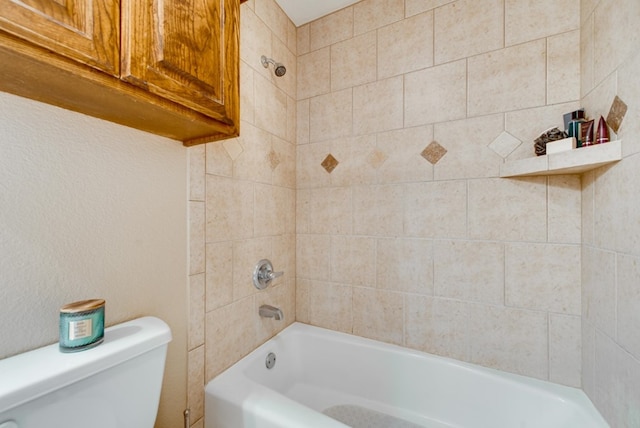 bathroom with bathing tub / shower combination and toilet