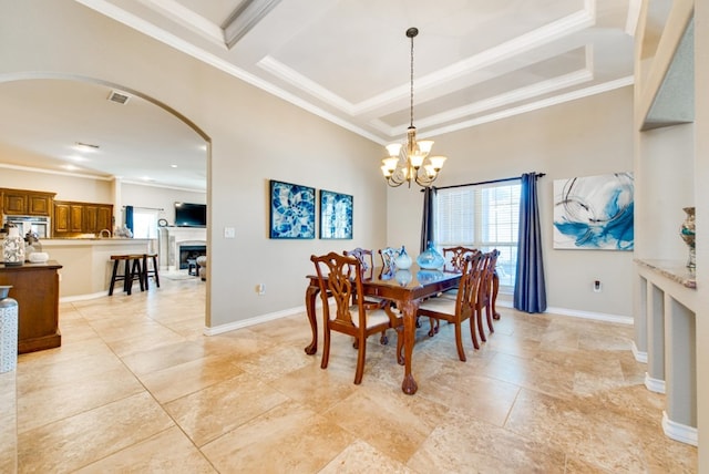 dining area with visible vents, a chandelier, arched walkways, and ornamental molding