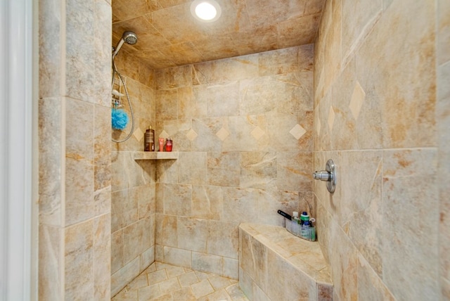 interior details with a tile shower