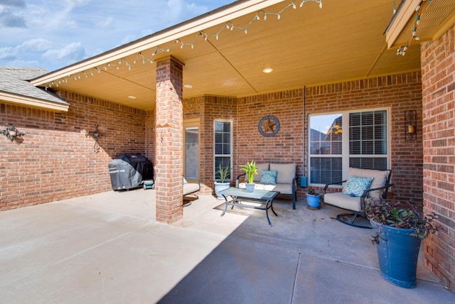 view of patio / terrace featuring outdoor lounge area and a grill