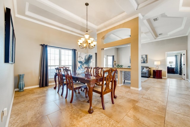 dining area with plenty of natural light, crown molding, and a notable chandelier