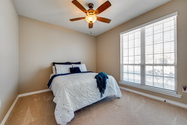 bedroom featuring carpet flooring, ceiling fan, and baseboards