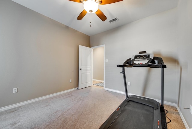 exercise room with ceiling fan, carpet floors, visible vents, and baseboards