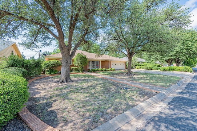3525 Stanolind Ave, Midland, TX 79707 - single story home with driveway and a garage