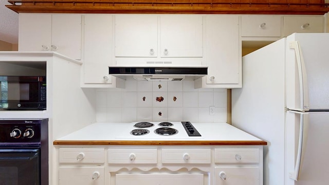 3525 Stanolind Ave, Midland, TX 79707 - kitchen with black appliances, ventilation hood, light countertops, and white cabinets