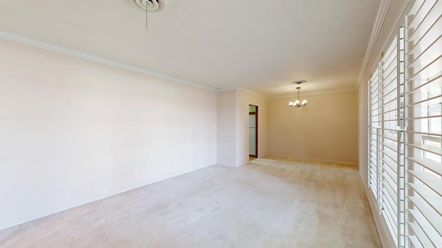 3525 Stanolind Ave, Midland, TX 79707 - unfurnished room featuring a chandelier, light carpet, and crown molding