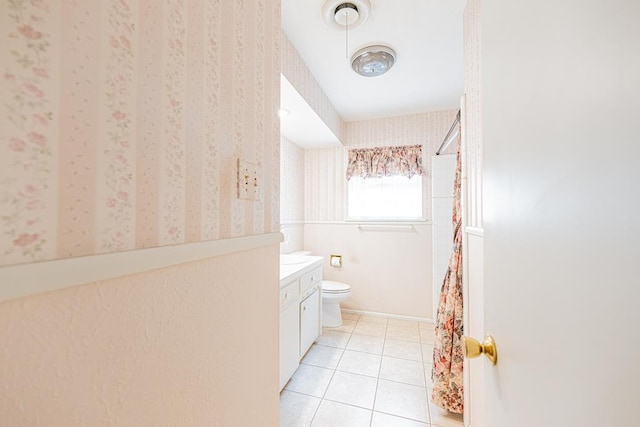 3525 Stanolind Ave, Midland, TX 79707 - full bathroom with tile patterned floors, vanity, curtained shower, and wallpapered walls