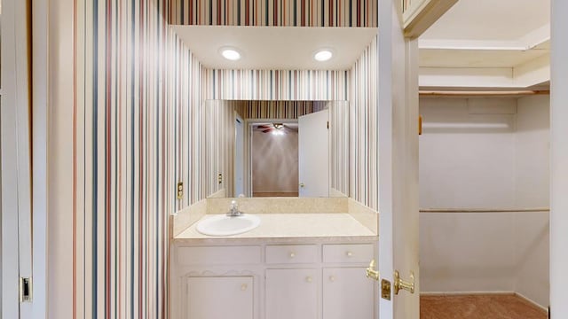 3525 Stanolind Ave, Midland, TX 79707 - bathroom with wallpapered walls and vanity