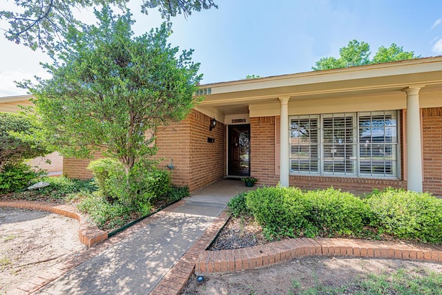 3525 Stanolind Ave, Midland, TX 79707 - property entrance featuring brick siding and covered porch