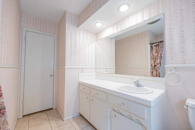 3525 Stanolind Ave, Midland, TX 79707 - full bath featuring wallpapered walls, vanity, and tile patterned flooring