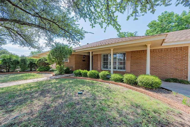 3525 Stanolind Ave, Midland, TX 79707 - ranch-style house featuring a front lawn and brick siding