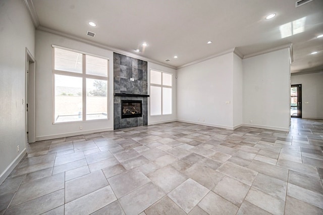 unfurnished living room featuring a tile fireplace and ornamental molding