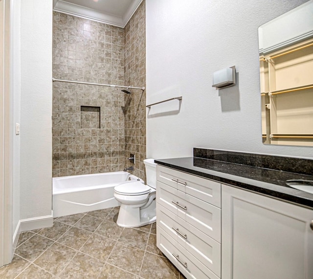 full bathroom featuring vanity, tile patterned flooring, tiled shower / bath combo, toilet, and ornamental molding