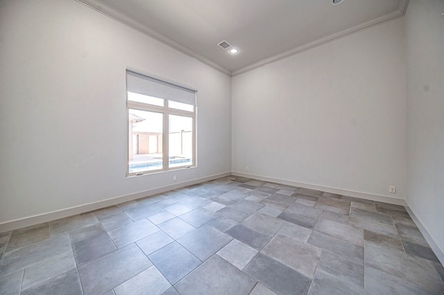 unfurnished room featuring crown molding