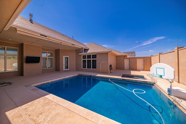 view of pool with a jacuzzi