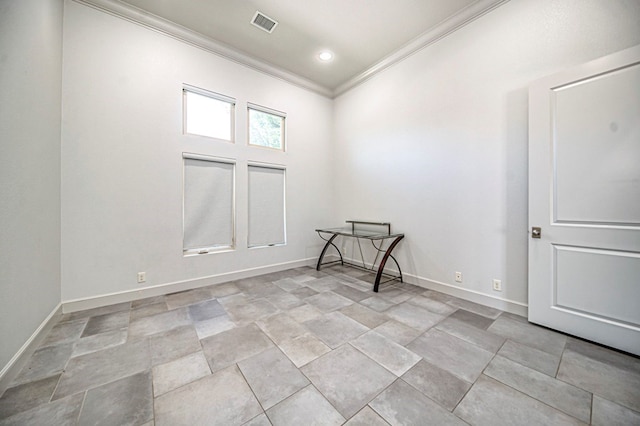 spare room featuring ornamental molding