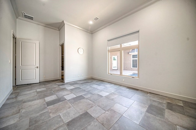 unfurnished room with crown molding