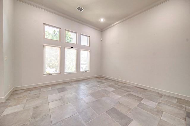 spare room featuring crown molding