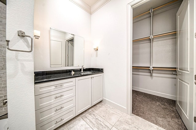 bathroom with vanity and crown molding