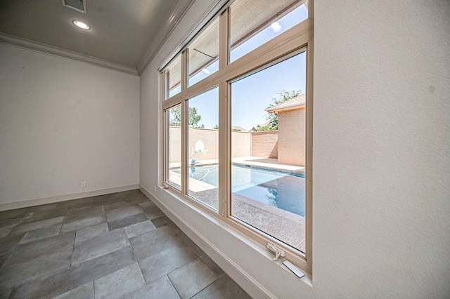 spare room with crown molding