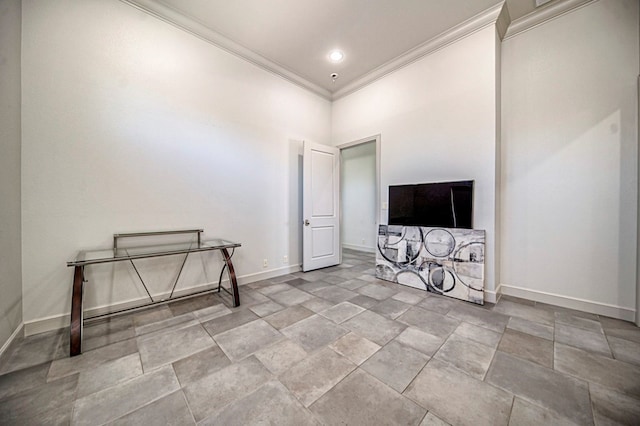 interior space featuring a high ceiling and crown molding