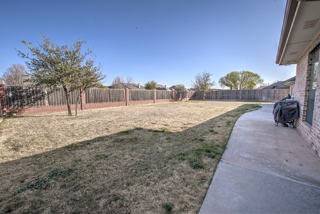 view of yard with a fenced backyard