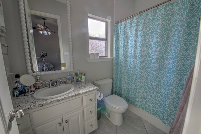 bathroom with a shower with curtain, tile patterned flooring, vanity, and toilet