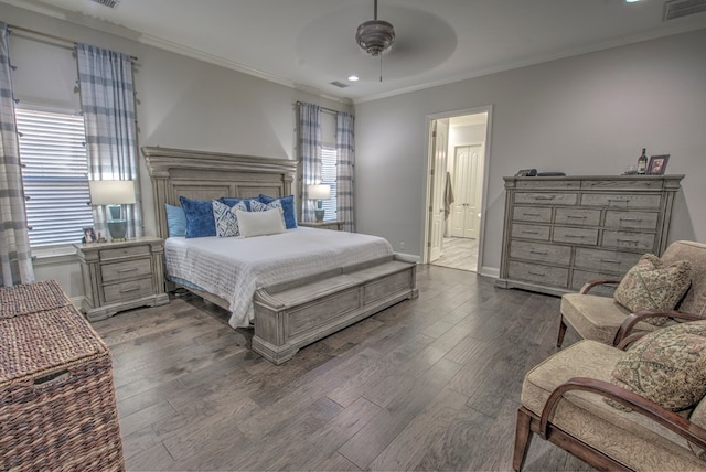 bedroom with ornamental molding, visible vents, multiple windows, and wood finished floors