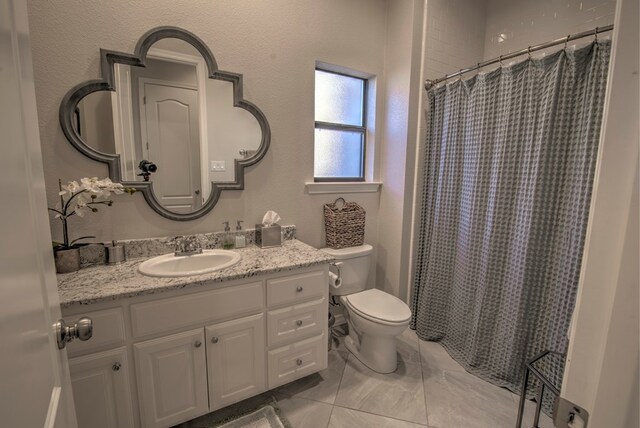 bathroom featuring toilet, a shower with curtain, and vanity