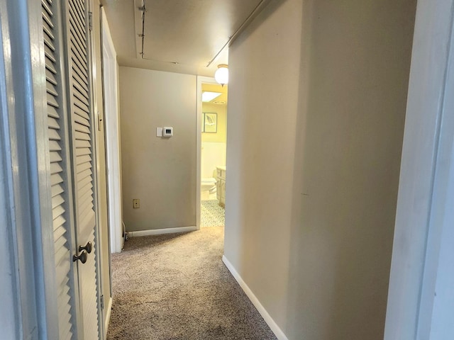 501 W Scharbauer Dr Unit 30, Midland, TX 79705 - hall featuring baseboards and carpet