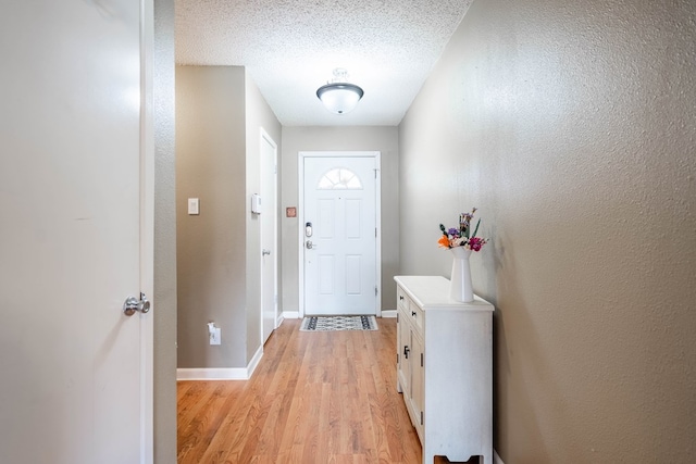 3702 W Michigan Ave, Midland, TX 79703 - entryway featuring light wood-style flooring and baseboards