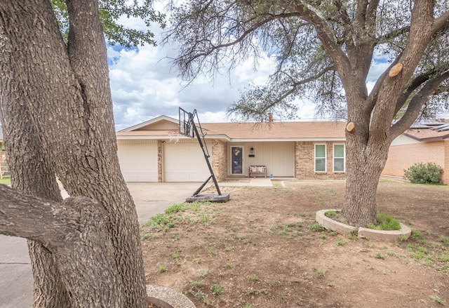 3702 W Michigan Ave, Midland, TX 79703 - single story home with driveway, an attached garage, and brick siding
