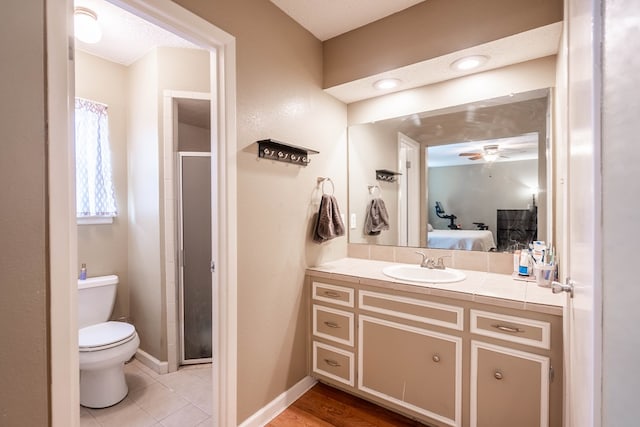 3702 W Michigan Ave, Midland, TX 79703 - full bath featuring vanity, ceiling fan, a stall shower, and ensuite bathroom