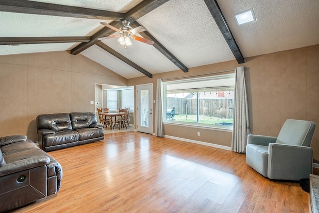 3702 W Michigan Ave, Midland, TX 79703 - living area with wood finished floors, ceiling fan, and a textured ceiling