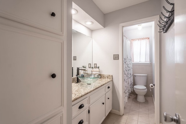 3702 W Michigan Ave, Midland, TX 79703 - bathroom featuring tile patterned floors, vanity, and curtained shower