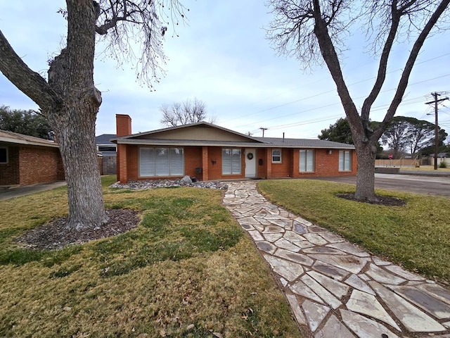 ranch-style house with a front lawn