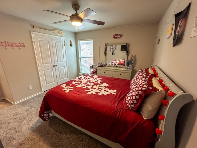 carpeted bedroom with a closet and ceiling fan