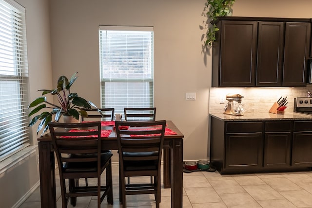 tiled dining space with a wealth of natural light