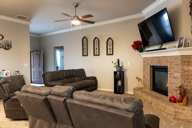 carpeted living room featuring crown molding, ceiling fan, and a fireplace