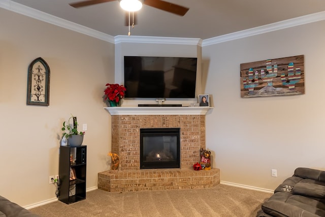 living room with ornamental molding, a brick fireplace, carpet floors, and ceiling fan