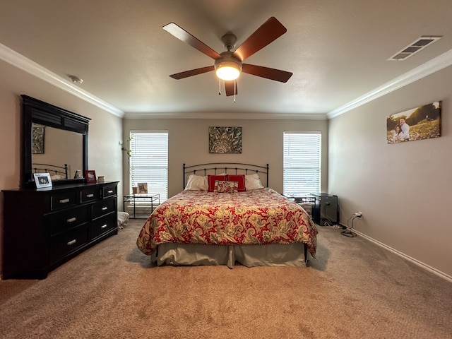 bedroom featuring crown molding, ceiling fan, and carpet flooring