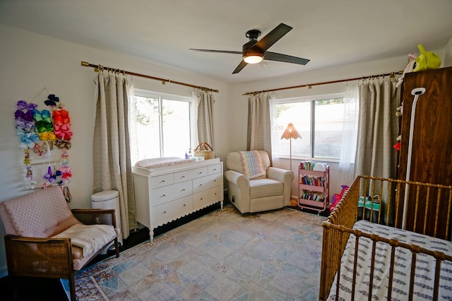 bedroom featuring ceiling fan and multiple windows