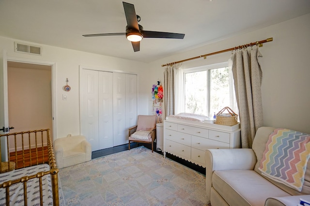 sitting room featuring ceiling fan