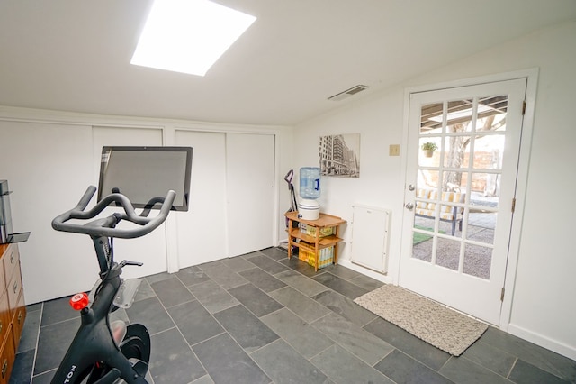 exercise area featuring lofted ceiling