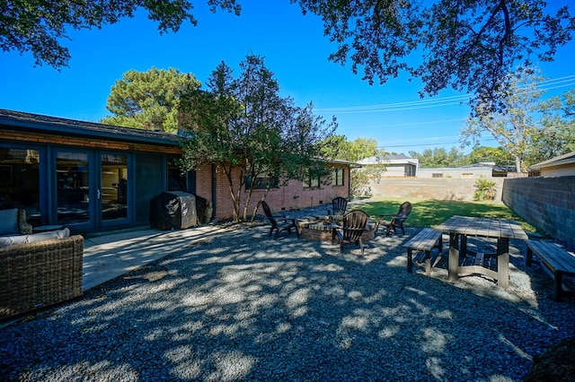 view of yard with a patio area and a fire pit