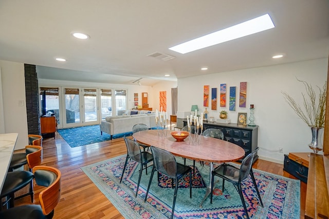 dining room featuring hardwood / wood-style floors and french doors