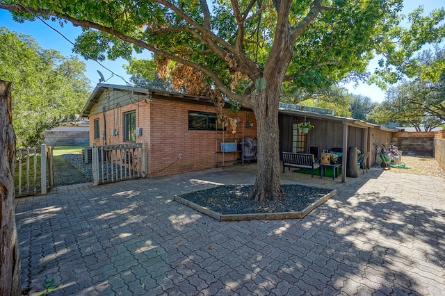 back of property with a patio area